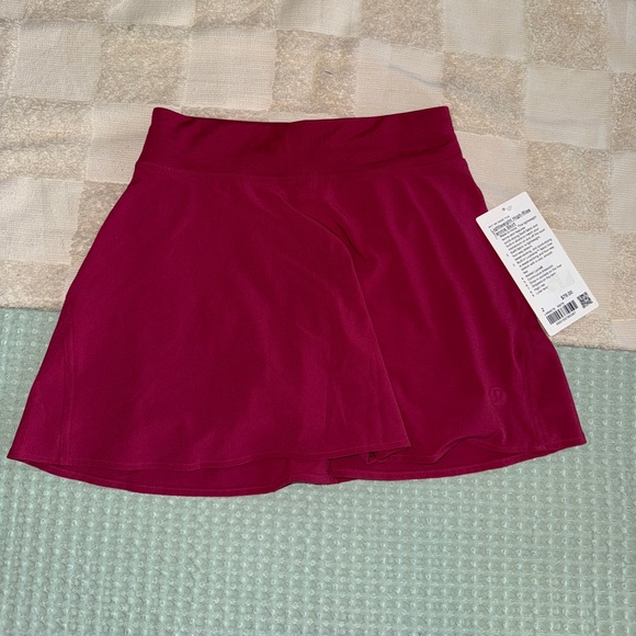 Lululemon Light Weight High- Rise Tennis Skirt
Size 2
Magenta Smoke - Picture 1 of 7